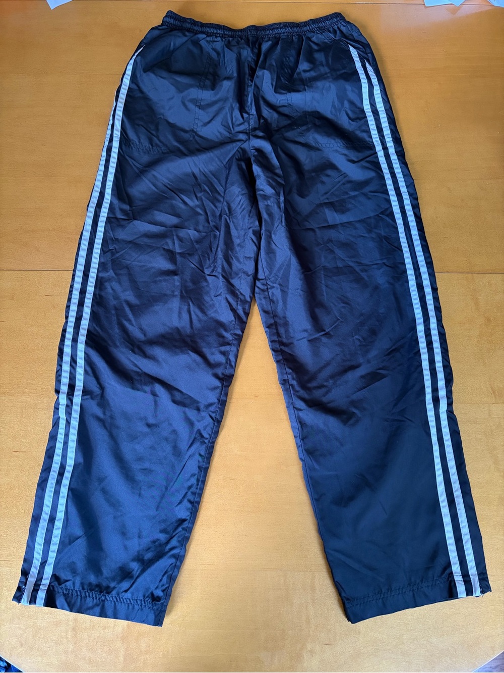 Premier black track pants with white Side Stripes